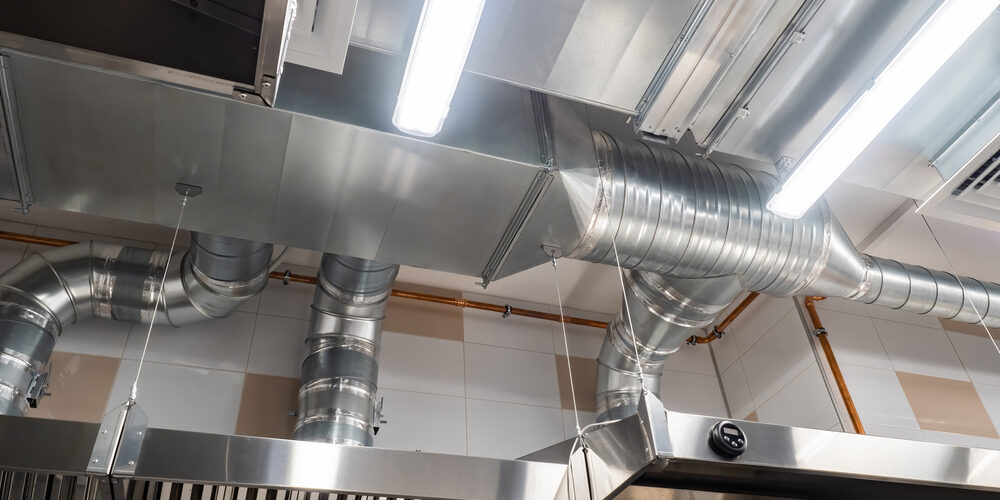Technician servicing a commercial kitchen exhaust fan – ProServe Mechanical Technician servicing a commercial kitchen exhaust fan – ProServe Mechanical