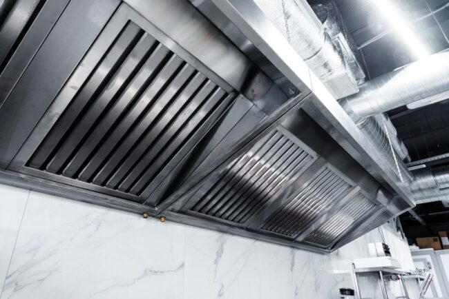 technician installing commercial kitchen exhaust hood – ProServe Mechanical technician installing commercial kitchen exhaust hood – ProServe Mechanical