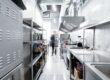 Technician performing commercial kitchen exhaust hood cleaning – ProServe Maintenance Group