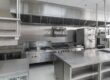 Technician opening kitchen exhaust access panel for maintenance – ProServe Hoods