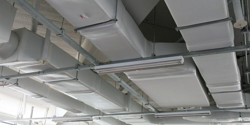 Commercial kitchen technician adjusting airflow for air balancing – ProServe Mechanical Commercial kitchen technician adjusting airflow for air balancing – ProServe Mechanical